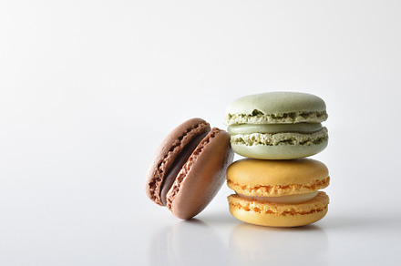 Stack of three flavor french macaroons white isolated background, a Food & Drink Photo by Davizro's Market