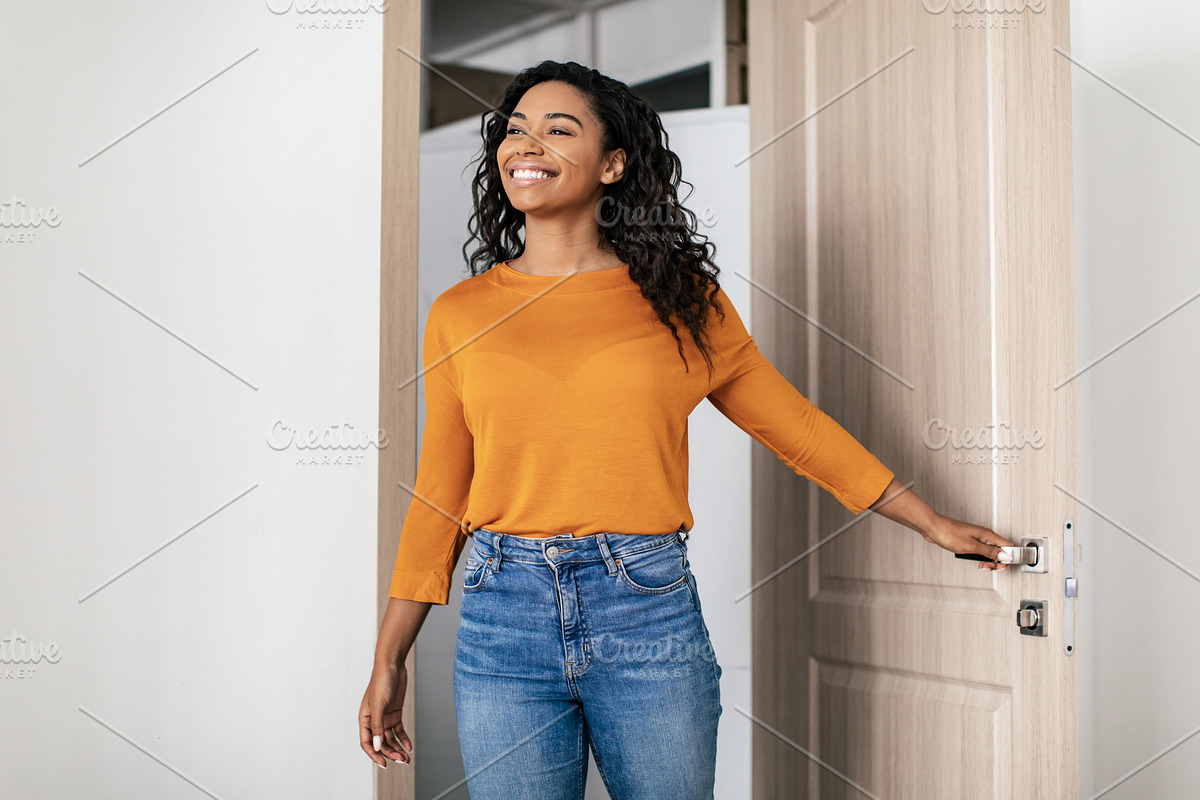 Happy Black Young Woman Entering Apartment Opening Entry Door, a Photo by Prostock-Studio (Photo 2 of 2)