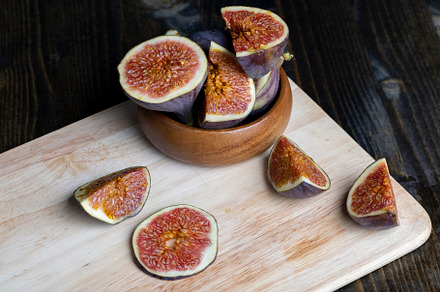 Ripe figs cut into pieces, close up, a Photo by MyPhotos