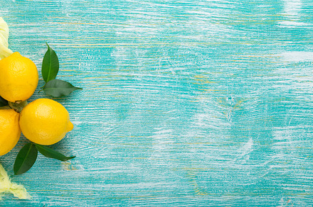 Lemons on wooden table featuring lemon, fruit, and citrus, a Food & Drink Photo by Irina Burakova