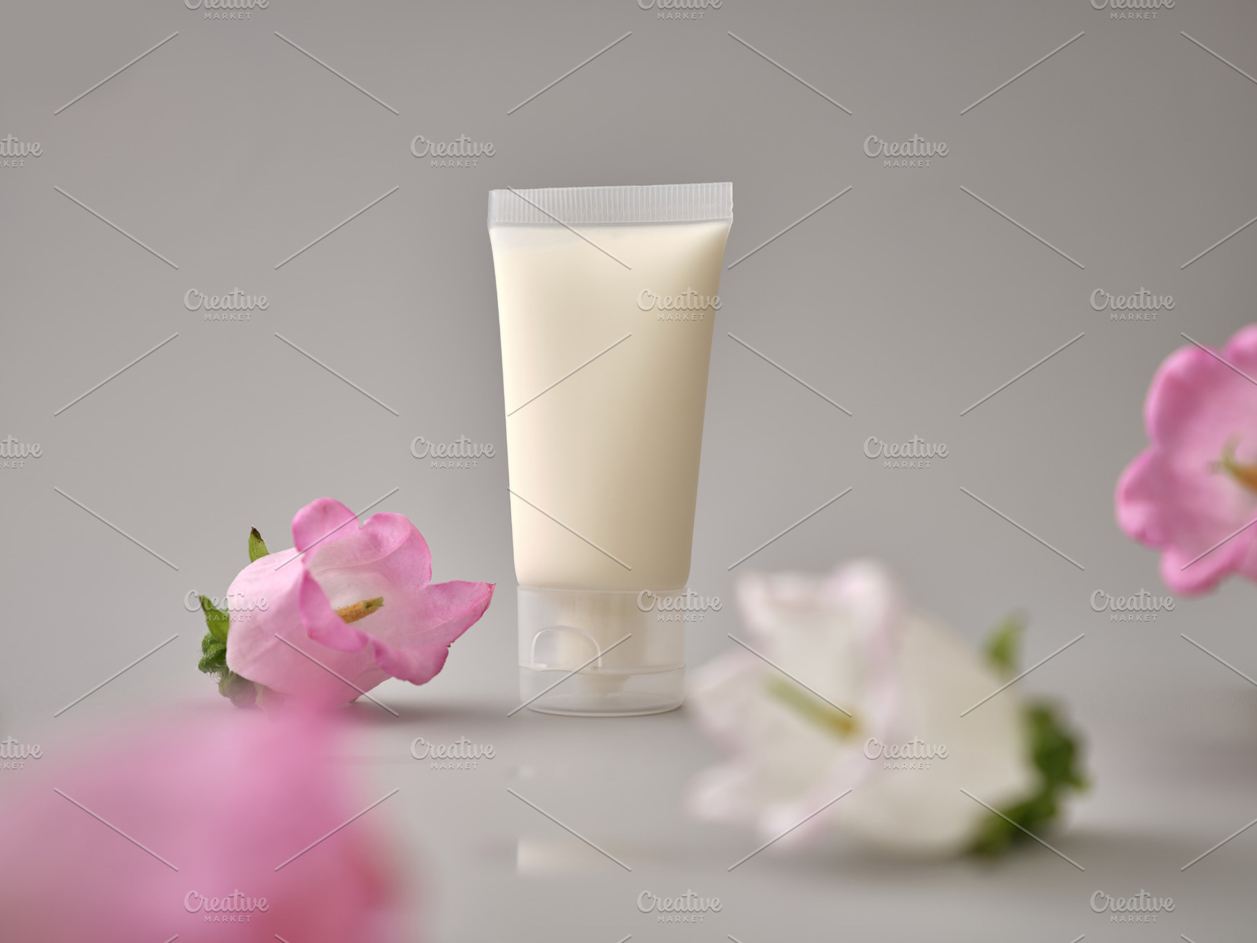 Skincare products on neutral background. Mockup bottles and flow, a Beauty & Fashion Photo by Asya Nurullina