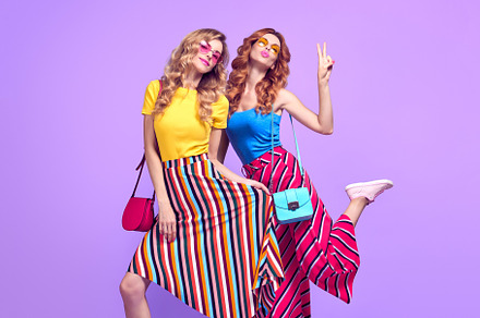 Two girls jumping having funfashion featuring two, girl, and fooling around