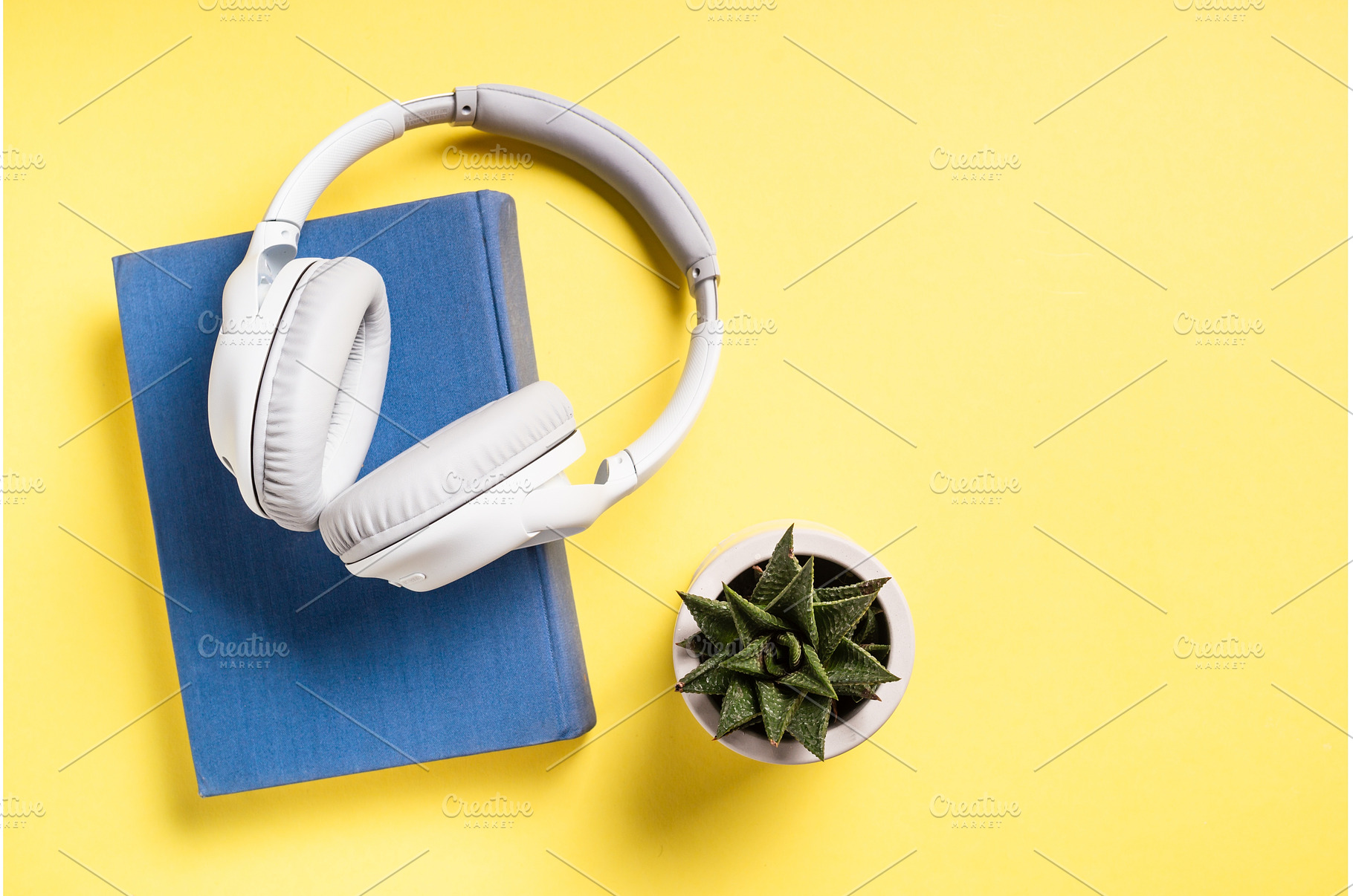 Headphones and books on yellow, a School & Education Photo by Nadia-nb