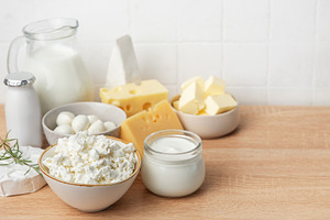 Assorted dairy products offering fresh healthy nutrition on wood, a Food & Drink Photo by Olena Rudo