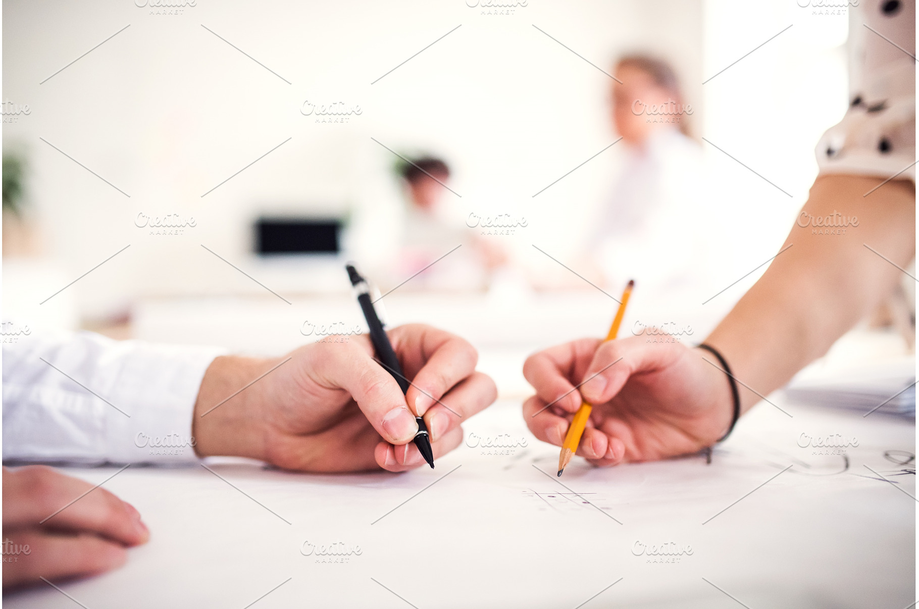 Close up on hands writing on paper, a Business Photo by HalfPoint