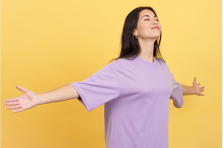 Relaxed woman with her arms open, a Person Photo by Iván Moreno STOCK PHOTO