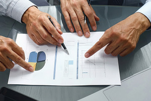 Business Team Reviewing Charts and Data, a Business Photo by Davizro's Market