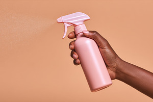 Hand with spray bottle, a Photo by Beautiful things