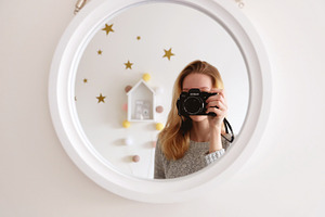 Girl, mirror, stars, cotton balls.