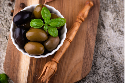 Bowl with Greek green and black, a Food & Drink Photo by Yulia Furman