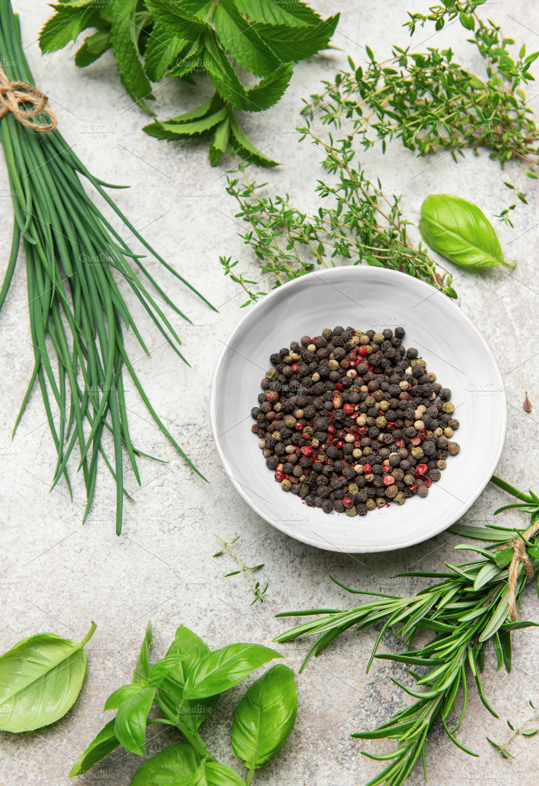 Fresh herbs and peppercorns creating culinary masterpiece on kit, a Food & Drink Photo by Olena Rudo