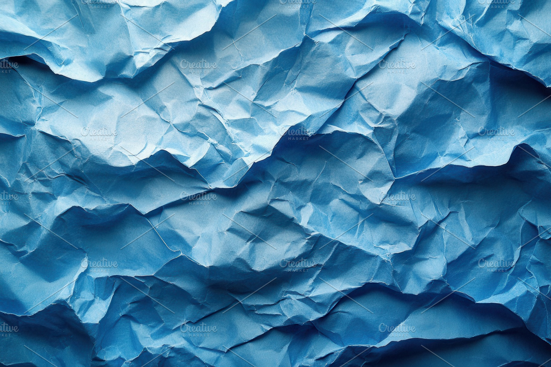 Crumpled blue paper texture resembli, a Photo by Tanuart