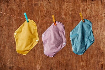 cloth menstrual pads hanging on a clothes line, a Photo by Nito