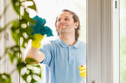 Happy man doing home chores, a Person Photo by Andriana Syvanych