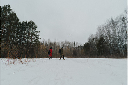 Two individuals dressed warmly in