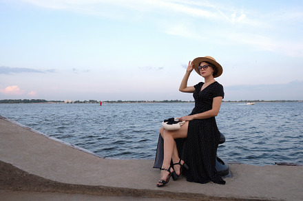 Woman in polka-dot dress poses