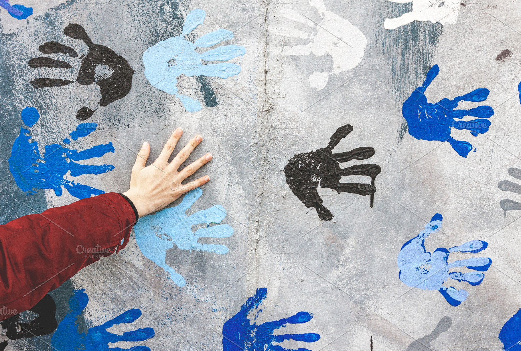 Human palm on wall with hand prints, an Arts & Entertainment Photo by BOOCYS