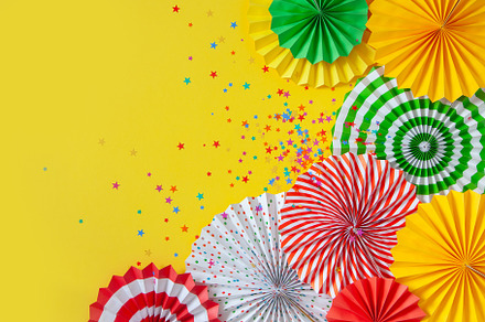 Colorful paper rosette and birthday garlands. Decorating for a p, a Beauty & Fashion Photo by Natalia Kostikova