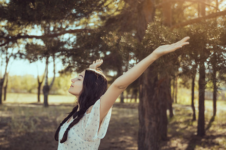 Happy woman in forest enjoying containing happy, joy, and summer, a Holiday Photo by Emotion photo