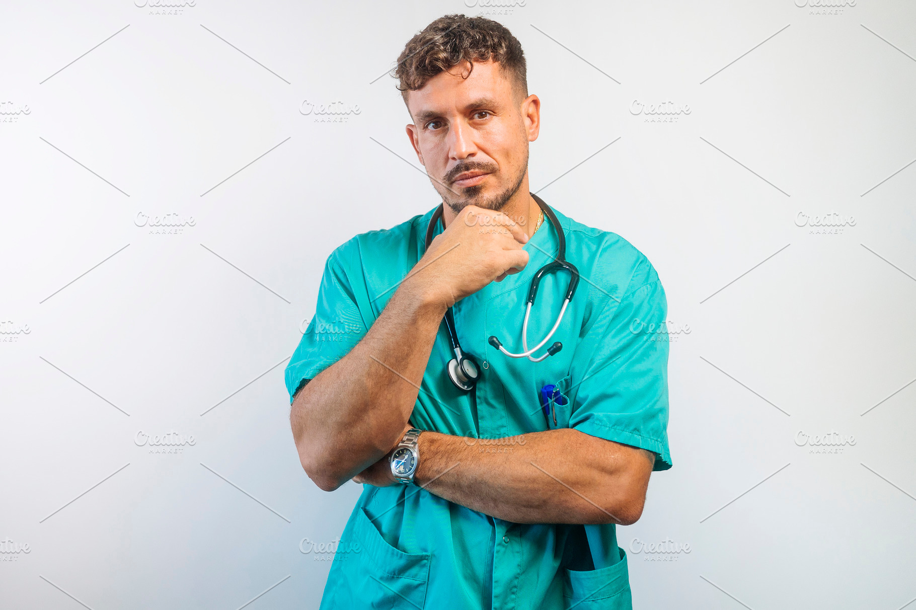 Serious Doctor with Hand on Chin Thinking, a Person Photo by karrastock