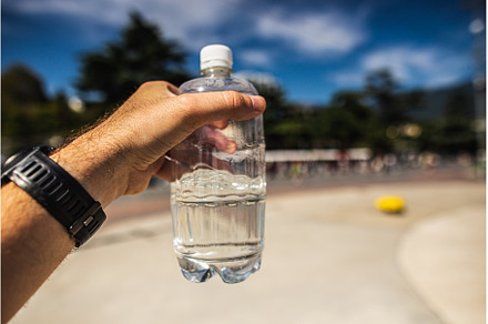 A bottle of fresh water in your hand