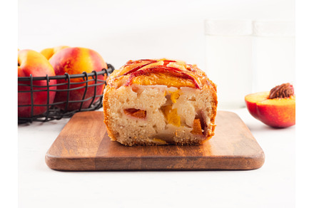 Peach cake loaf on wooden cutting