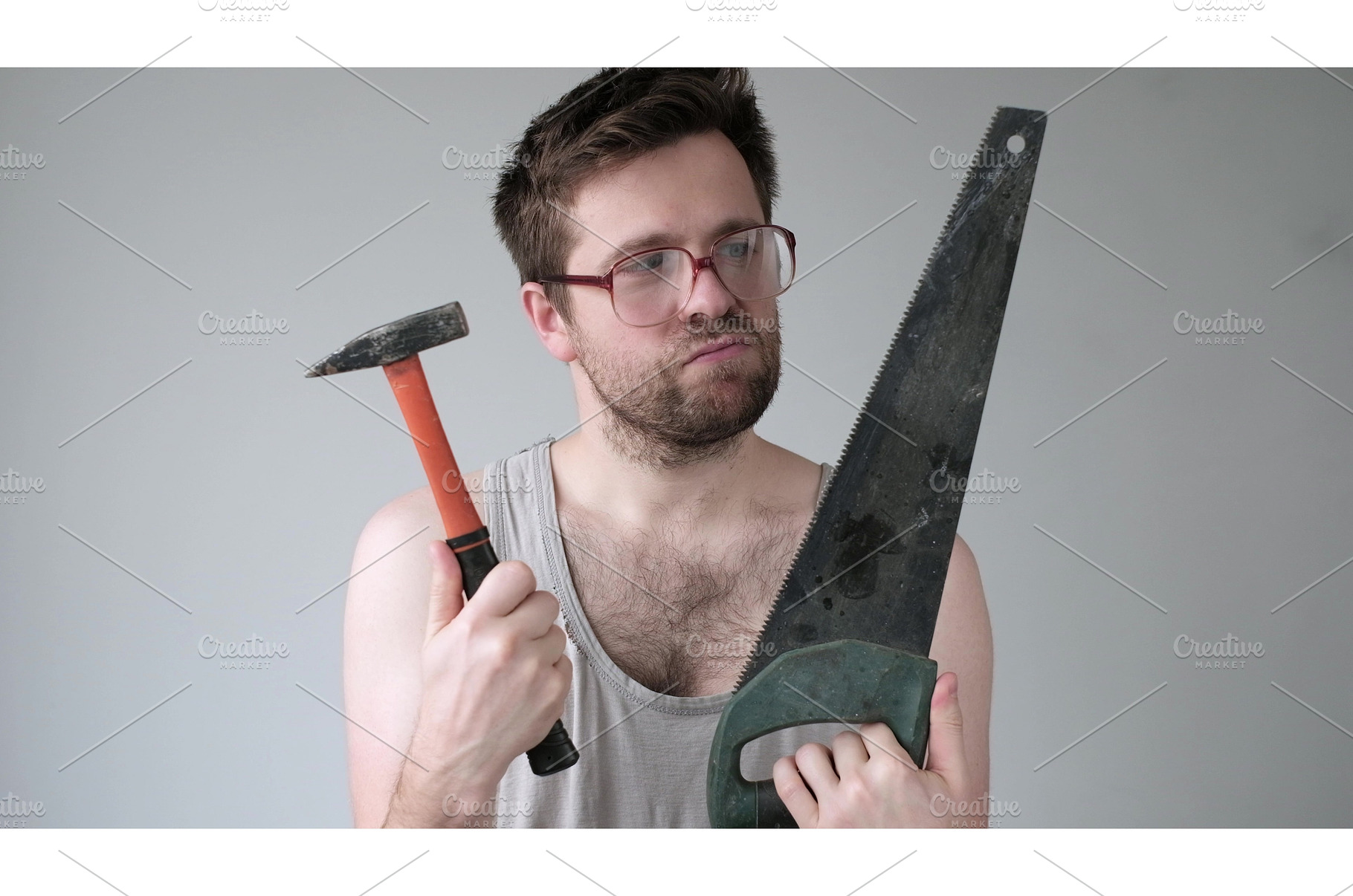 Funny young caucasian man choosing, an Industrial Photo by Koldunova