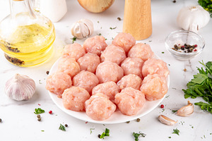 Raw uncooked chicken meatballs with spices, a Food & Drink Photo by Rimma