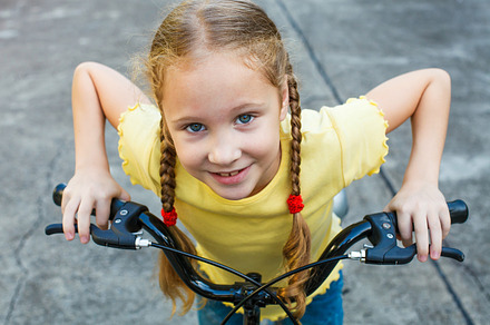 Happy child on a bicycle containing happy, sport, and fun, a Sports & Recreation Photo by altanaka