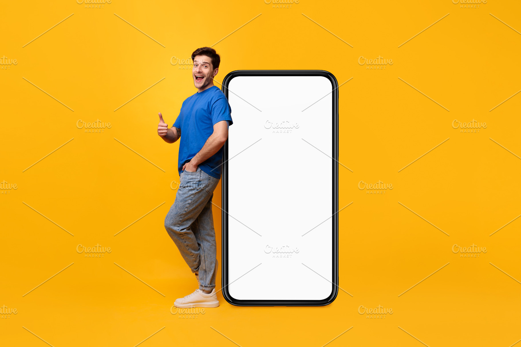 Man leaning on white blank smartphone screen showing thumbs up, a Photo by Prostock-Studio