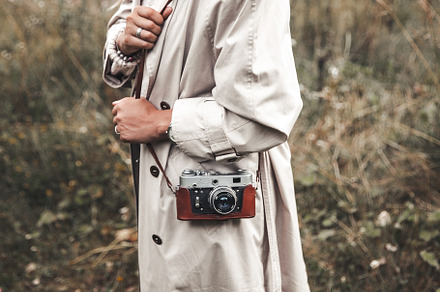 Beautiful woman in a beige raincoat
