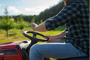 Close up of farmer driving small, a Business Photo by HalfPoint