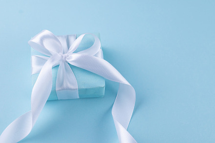 Christmas blue background. Holidays gift box wrapped in blue pap, a Holiday Photo by vimart