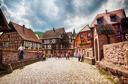 tourists on bridge, Alsace village, an Architecture Photo by ariadna de raadt