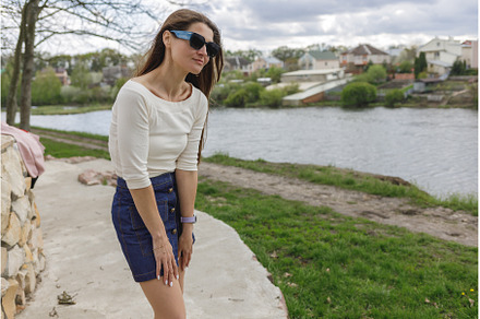 Young woman in short denim skirt and, a Person Photo by serkum