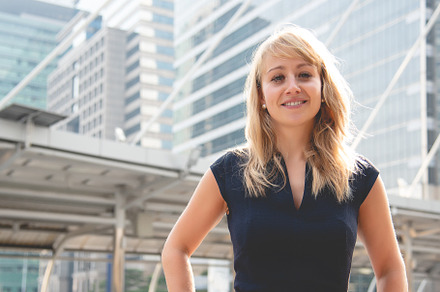 Beauty woman portrait with city and building background. Happy l, a Person Photo by Ministocker