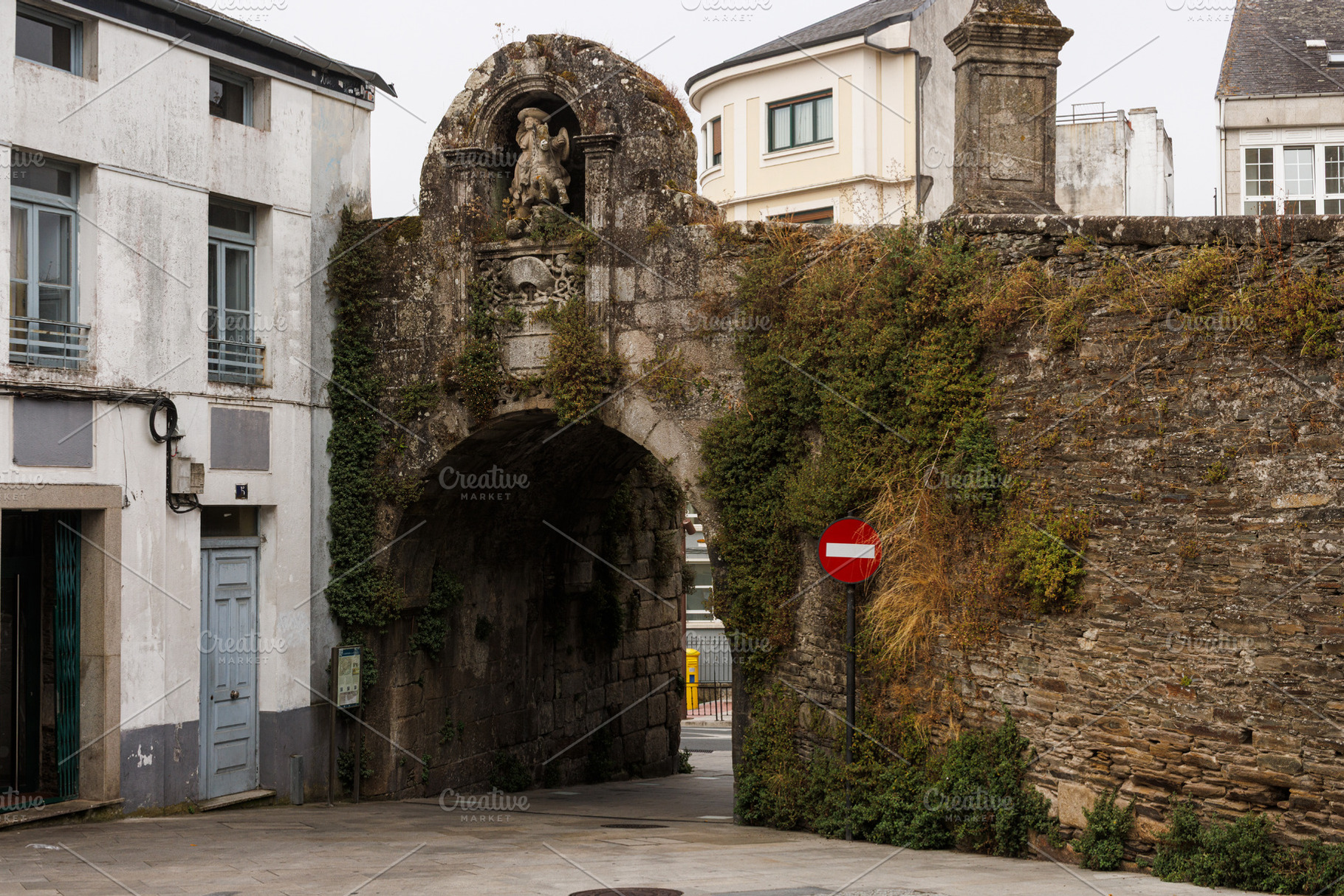 Historic Stone Archway with Statue and Ivy, Lugo, Spain, an Architecture Photo by Bepslabor