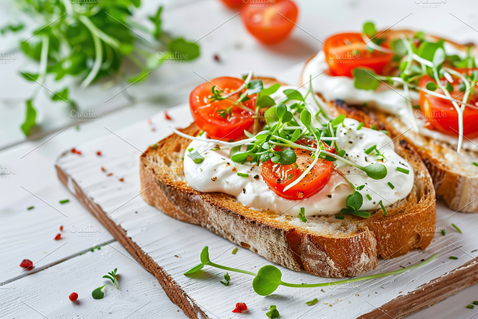 Sandwich with cream cheese, microgreens and tomatoes on wooden table, a Food & Drink Photo by AlyaAnd