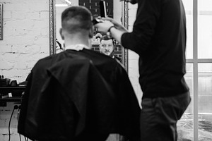 bearded man cutting his beard in the barbershop, a Person Photo by Weddings, People, Travel