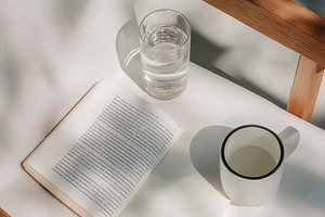 Empty chair with open book, notebook, a Photo by Dvoevnore photos