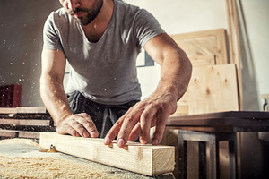 Carpenter working  at wooden bar, an Industrial Photo by Sova