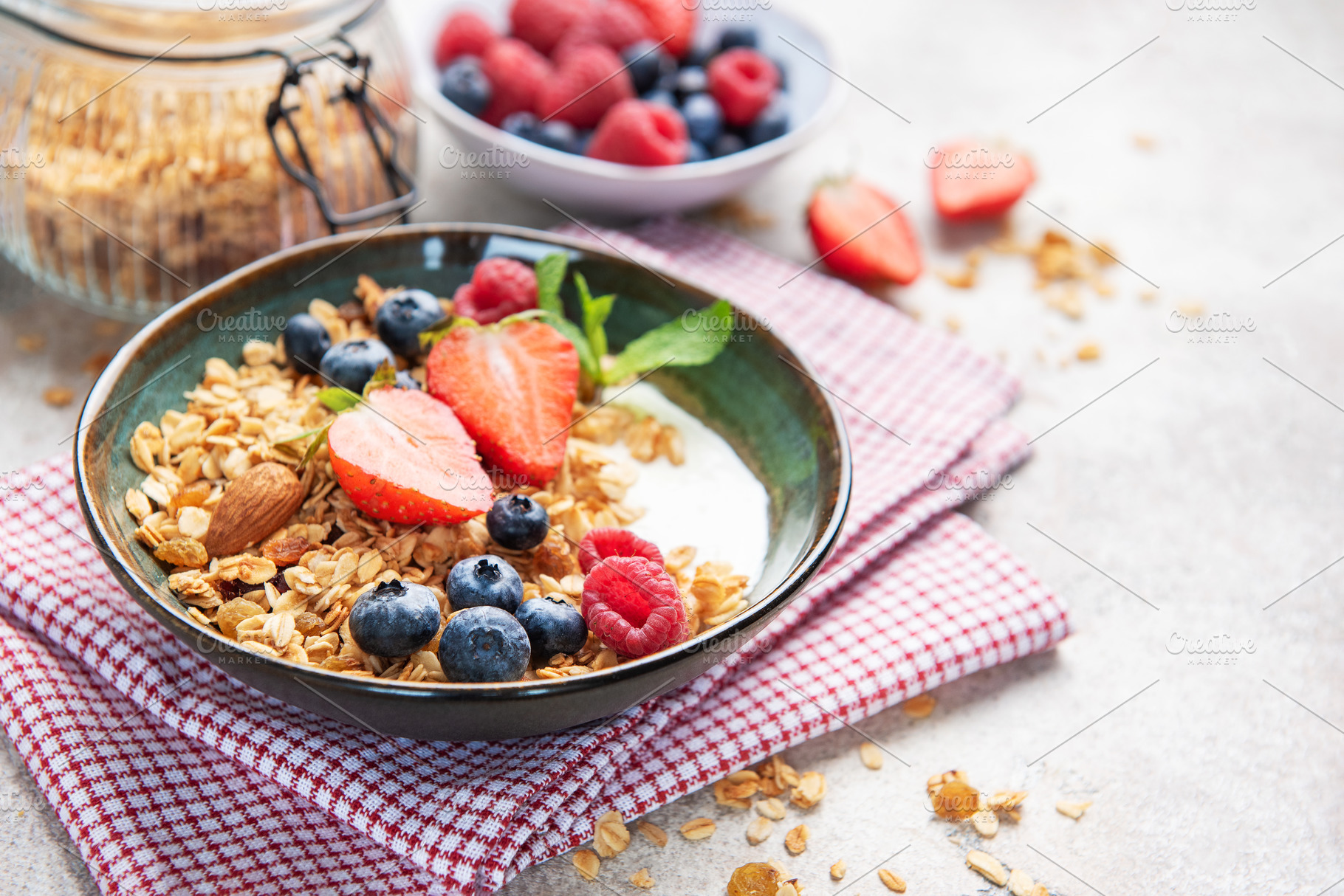 Granola bowl with fresh berries yogurt and nuts, a Food & Drink Photo by Olena Rudo
