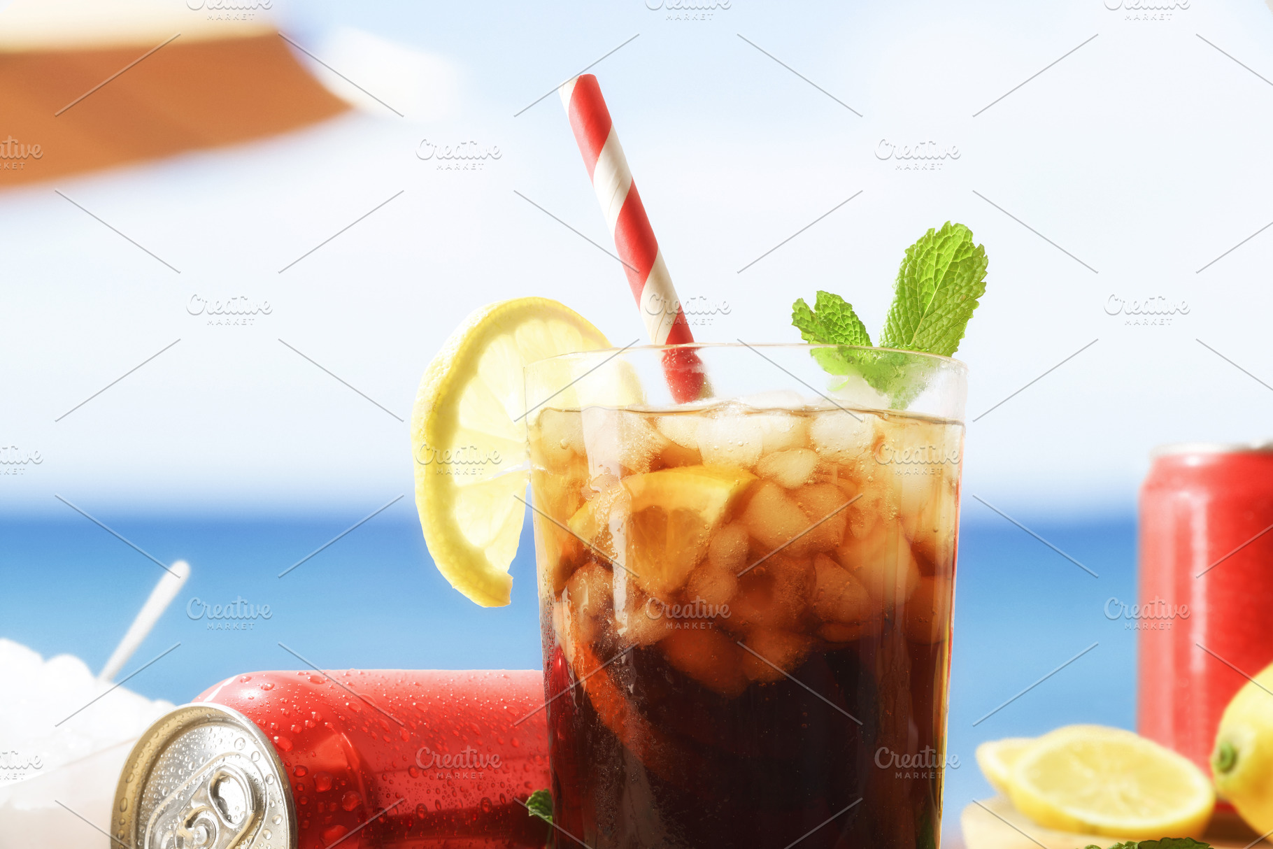 Cola in a glass with ice on a hot beach, a Food & Drink Photo by Davizro's Market