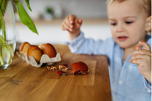 Little boy and easter eggs dyed with, a Holiday Photo by HalfPoint