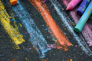 Seamless Colorful Chalk Drawings On A Dark Pavement, Featuring Vibrant Lines In