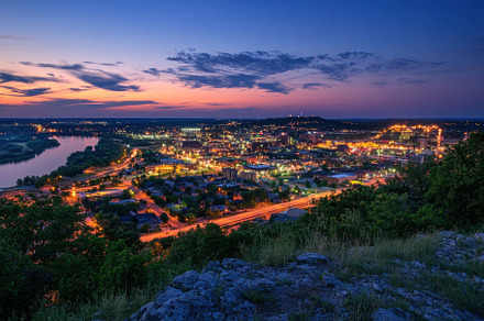 Vibrant City Skyline Illuminated at, a Photo by Tanuart