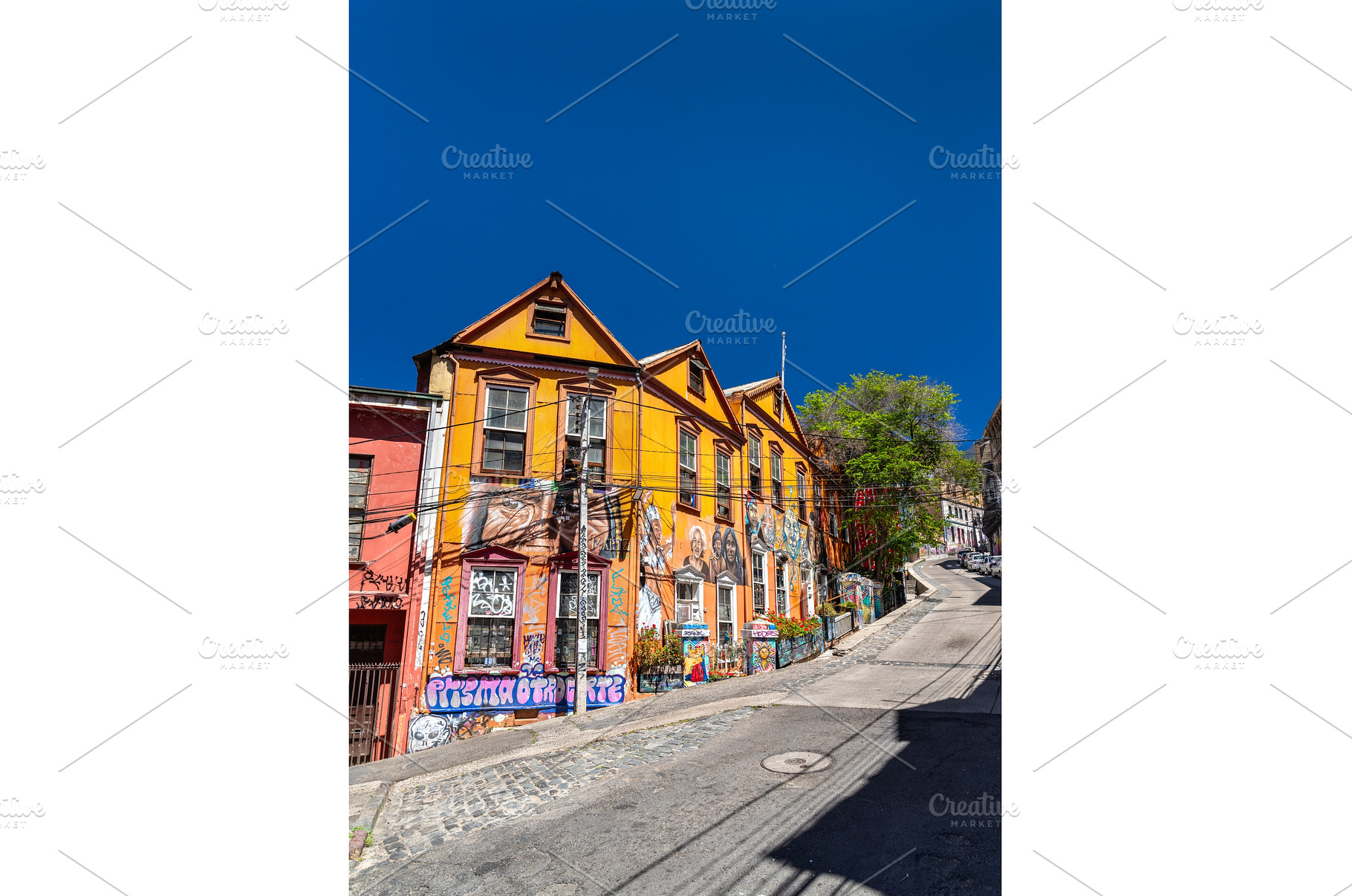 Colorful houses with murals on, an Architecture Photo by Leonid Andronov