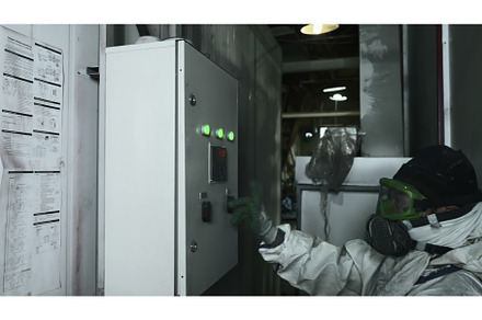 Worker in work uniform presses, an Industrial Photo by Media Whale Stock