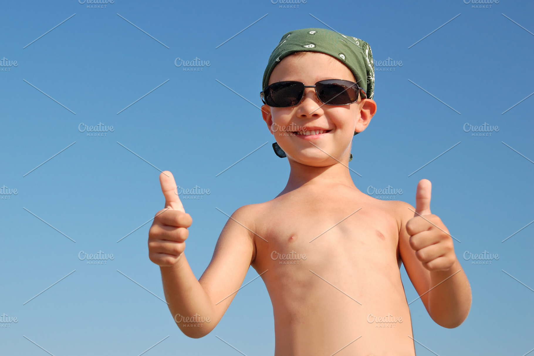 Happy child with thumbs up