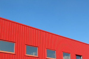 Red building with blue sky stock photo containing urban and geometry